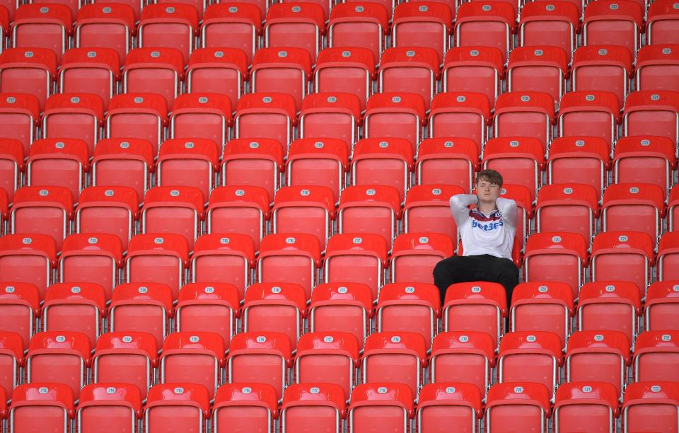  Another fan struggles to leave his seat long after the final whistle