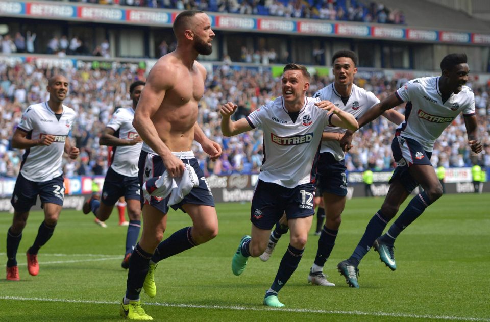  Aaron Wilbraham goes bare-chested as delighted Bolton players celebrate the win that kept them in the Championship