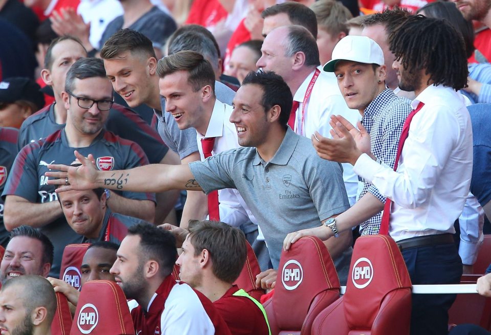  Mesut Ozil in the stands at Arsenal on Sunday alongside Santi Cazorla and Mohamed Elneny