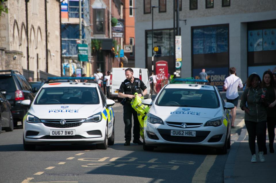  Police cars in the city centre after reports of a shootout between police and an armed man