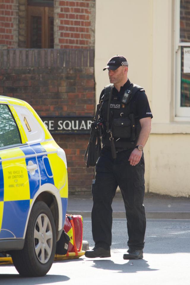  Armed officers in Paradise Square