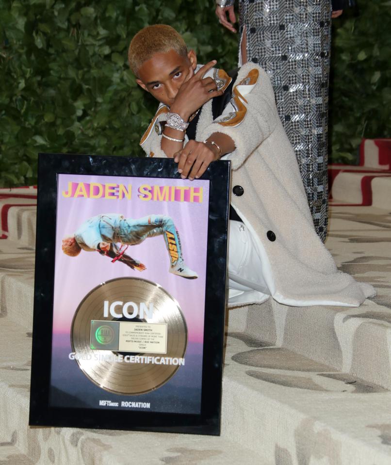  The 19-year-old posed with the framed record on the red carpet