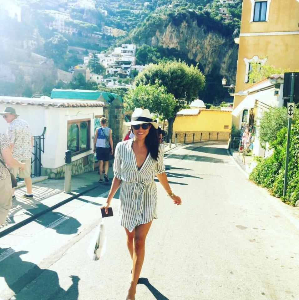  Meghan Markle grins while on holiday in Positano, Italy