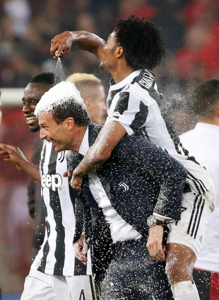  Juventus boss Massimiliano Allegri was covered in the referee's foam during the celebrations