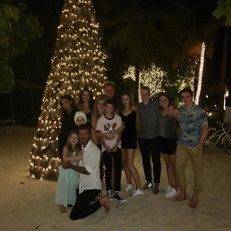  The Beckham family pose with the Ramsay's on a trip to Soneva Fushi