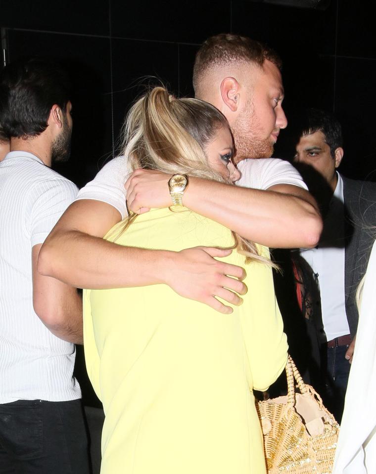  Adam - who is the brother of Towie star Yazmin Oukhellou - wrapped his arms tightly around Chloe