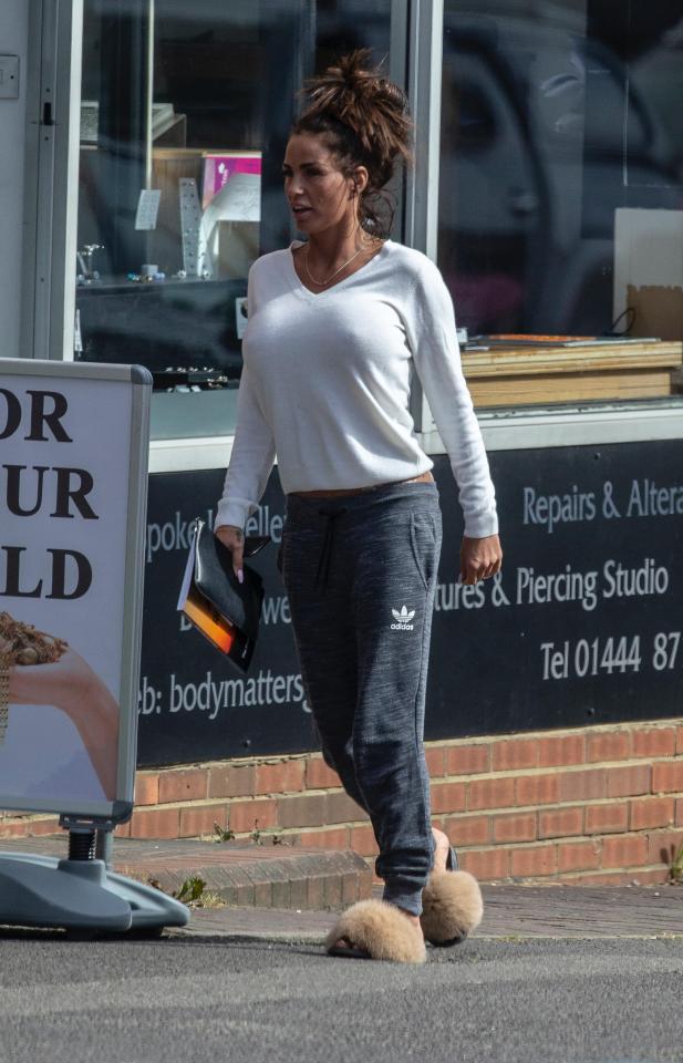  Katie Price sports fluffy shoes and tracksuit on visit to a tattoo parlour