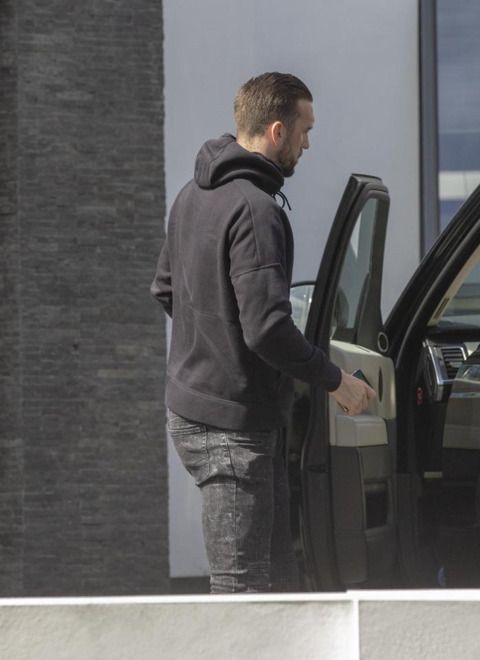  Shane Duffy appears to be heading away from his home after Katie's husband accused her of spending the night with him