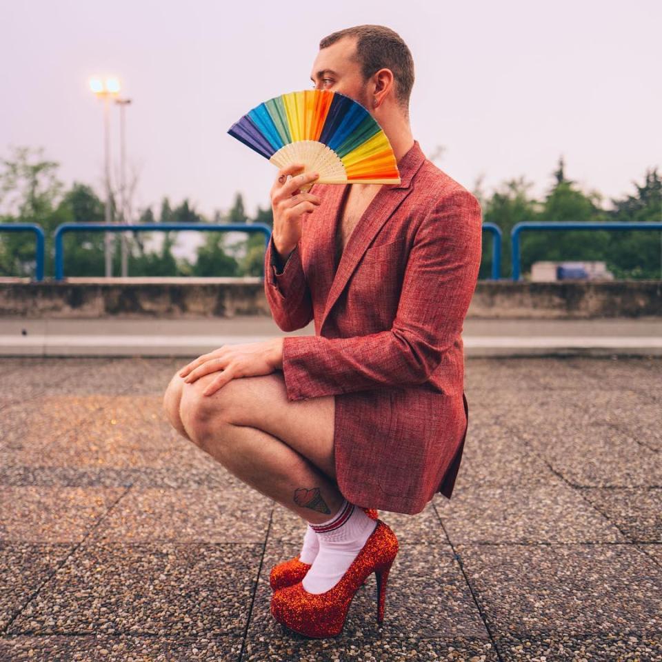  Sam Smith posed with these red heels and rainbow fan