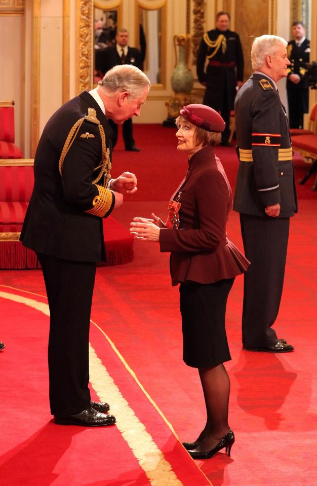  Tessa Jowell being made a Dame by the Prince of Wales at Buckingham Palace