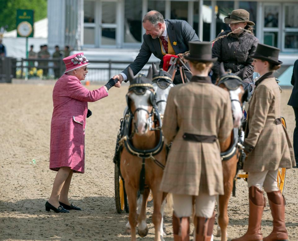  The Queen meets competitors as they take part in the horse show held in the grounds of Windsor Castle