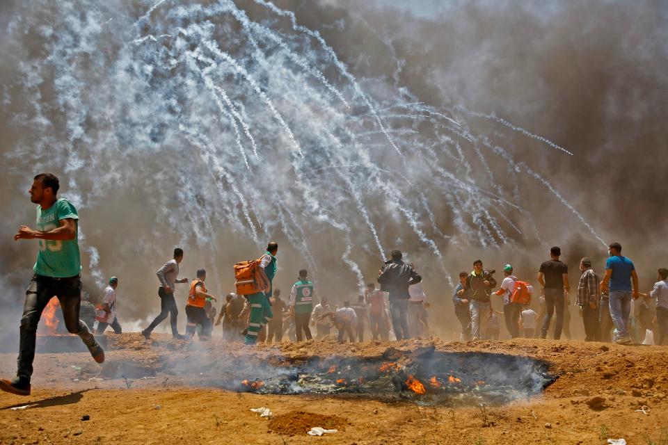  Tear gas canisters rain down on protesters in Gaza near the Israeli border