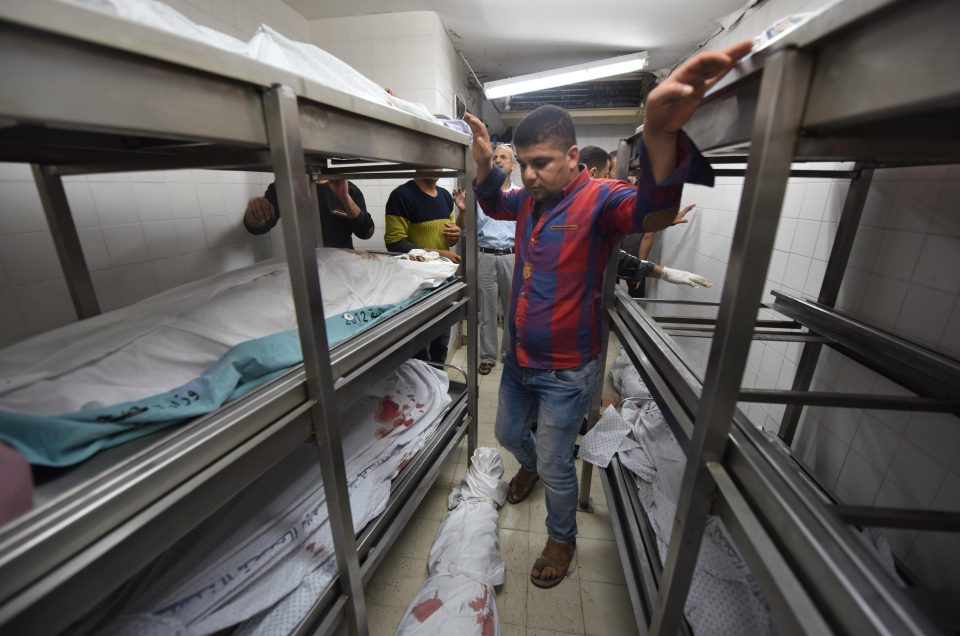  Bodies stacked up in a Gaza morgue after 60 Palestinians were killed in a day