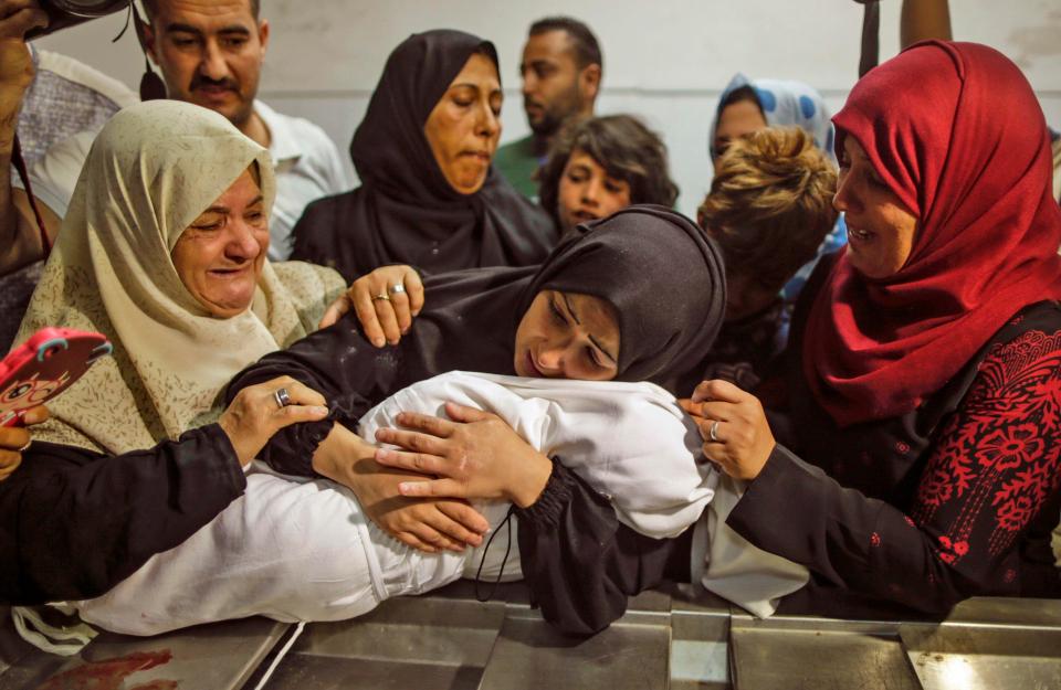  The family of baby Leila al-Ghandour cradle her body after she died inhaling tear gas