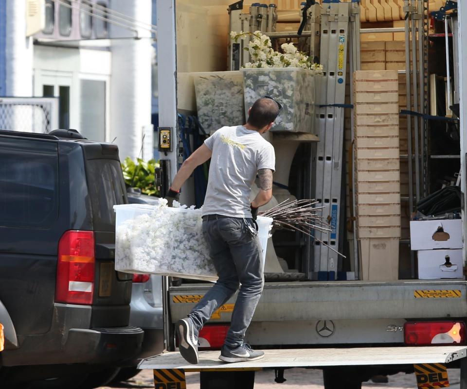  Dozens of boxes of flowers were seen in the delivery truck