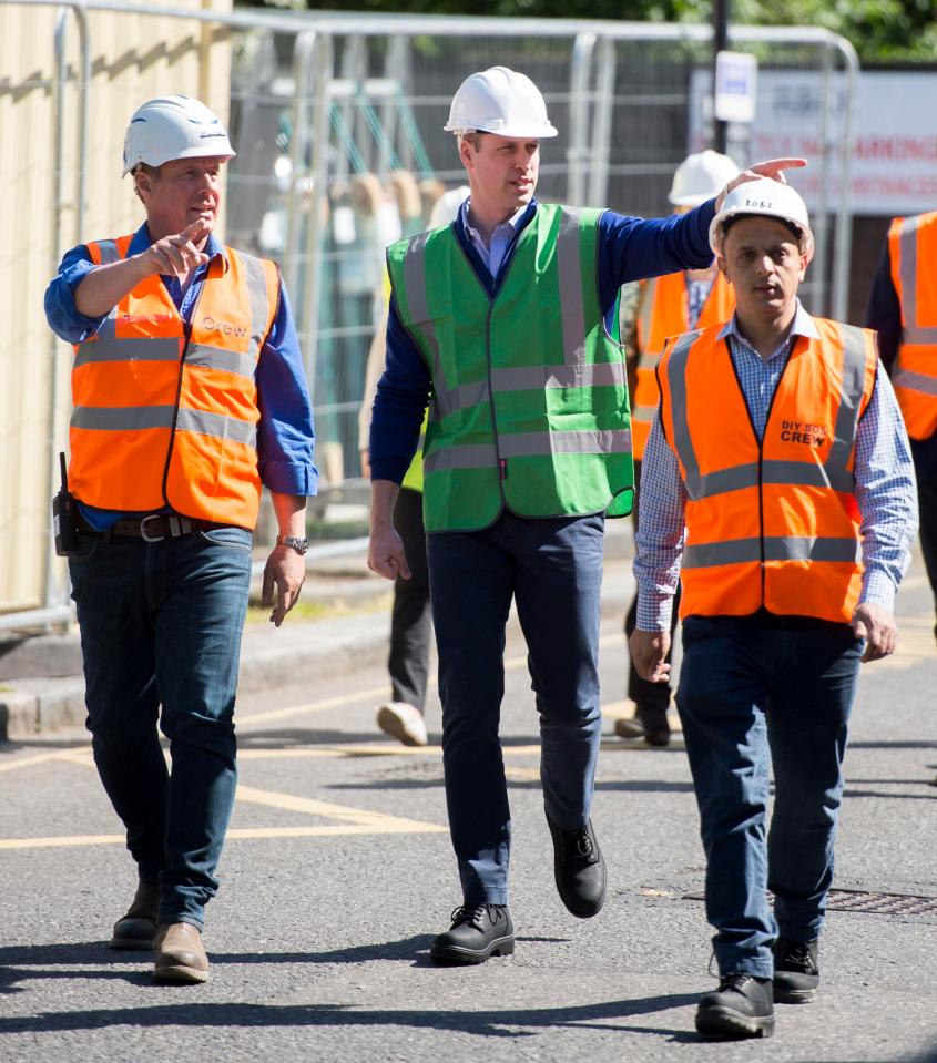  The Duke of Cambridge inspects the site of the new boxing club after its original home was destroyed by the blaze