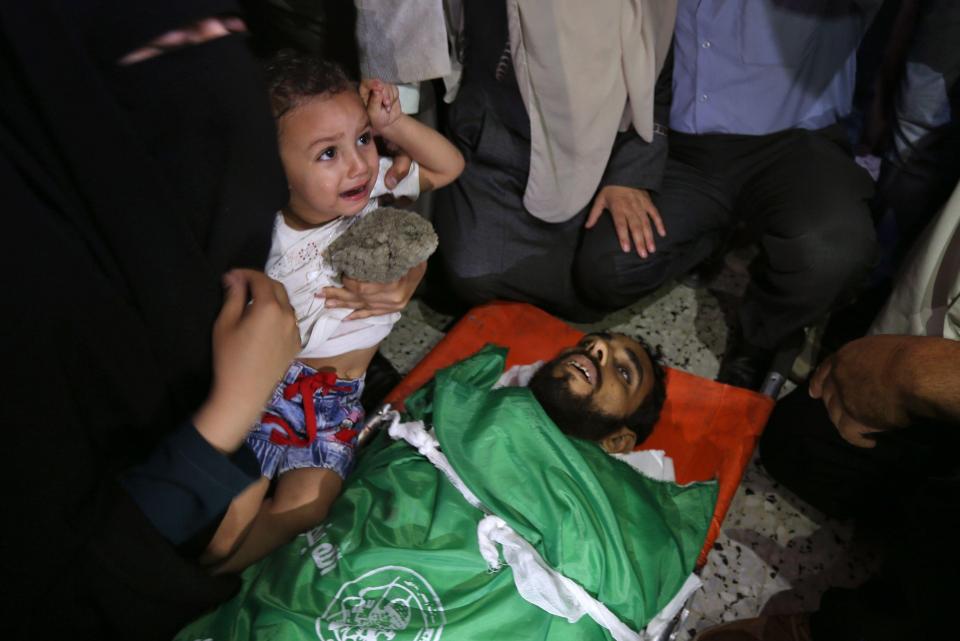  A small child cries over the death of her 27-year-old father during clashes along the Gaza border yesterday