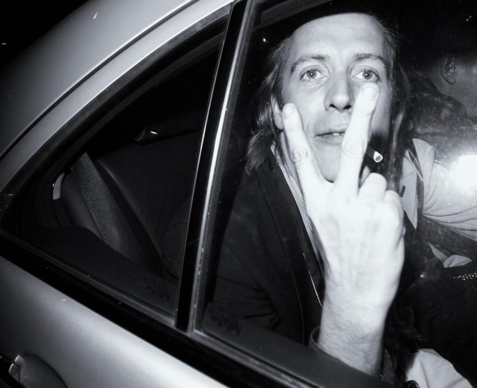  Actor Rhys Ifans swears at photographers as he leaves St Martin's Lane hotel in London