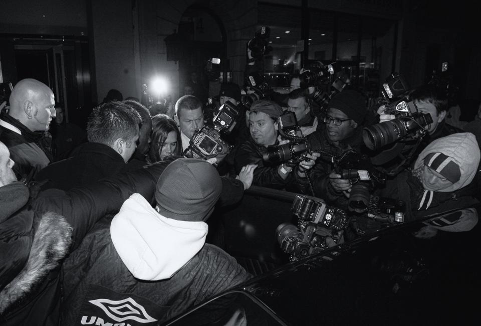  Victoria Beckham is swamped by awaiting photographers as she leaves a restaurant near Piccadilly