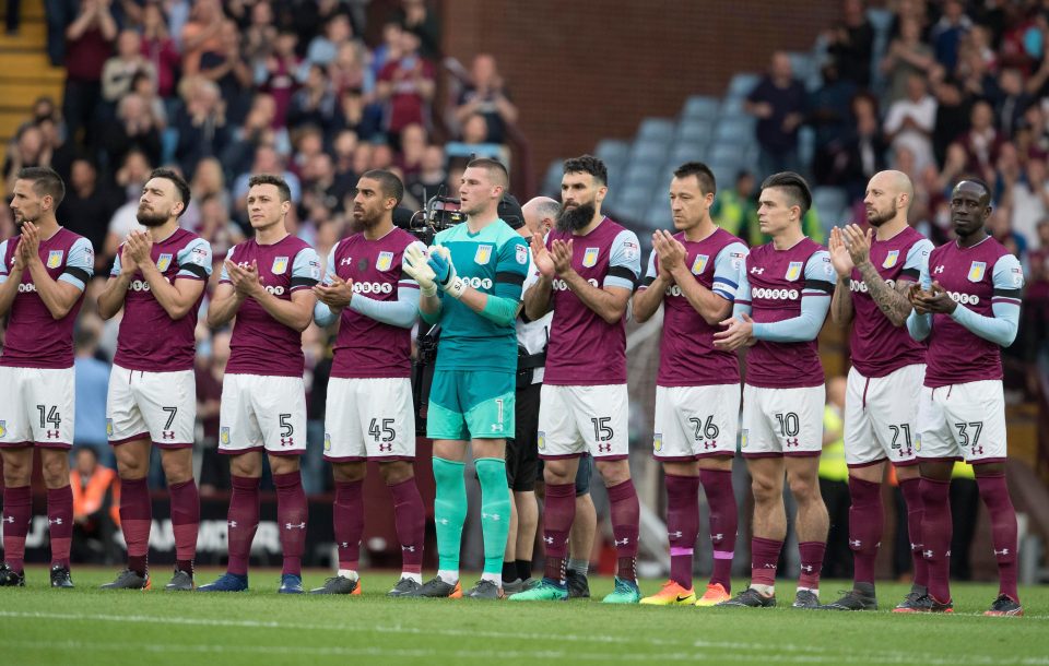  Aston Villa players wear black armbands to remember their former player