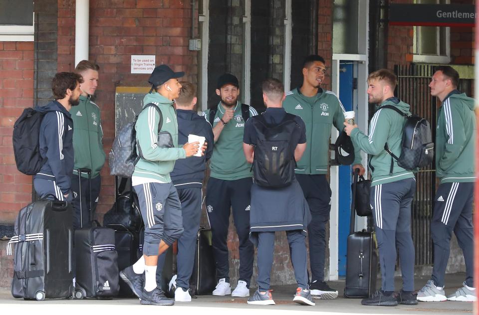  United's players wait on the platform at Stockport station on Wednesday afternoon