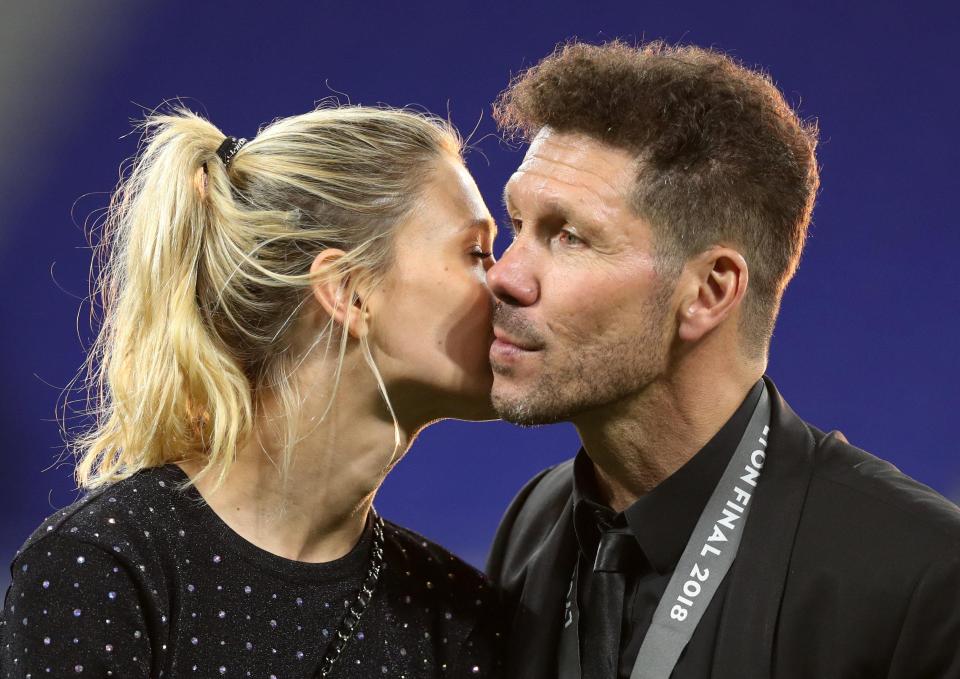  Carla Pereyra, 30, kisses boyfriend Diego Simeone, 48, on the cheek in Lyon