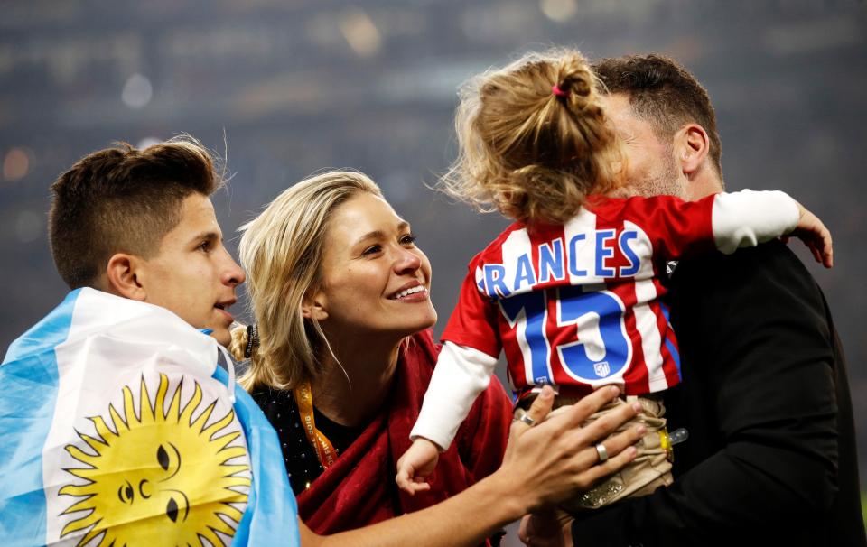  Diego Simeone and girlfriend Carla hold baby Francesca on Lyon pitch