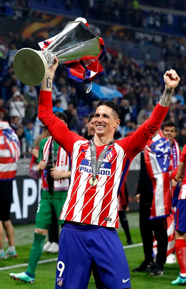  Fernando Torres celebrates lifting his only major trophy at Atletico Madrid