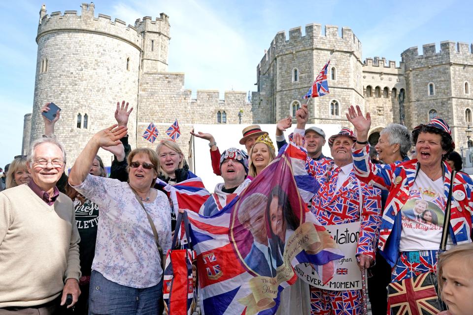 Royal fans have draped themselves in Union Jacks to celebrate the wedding