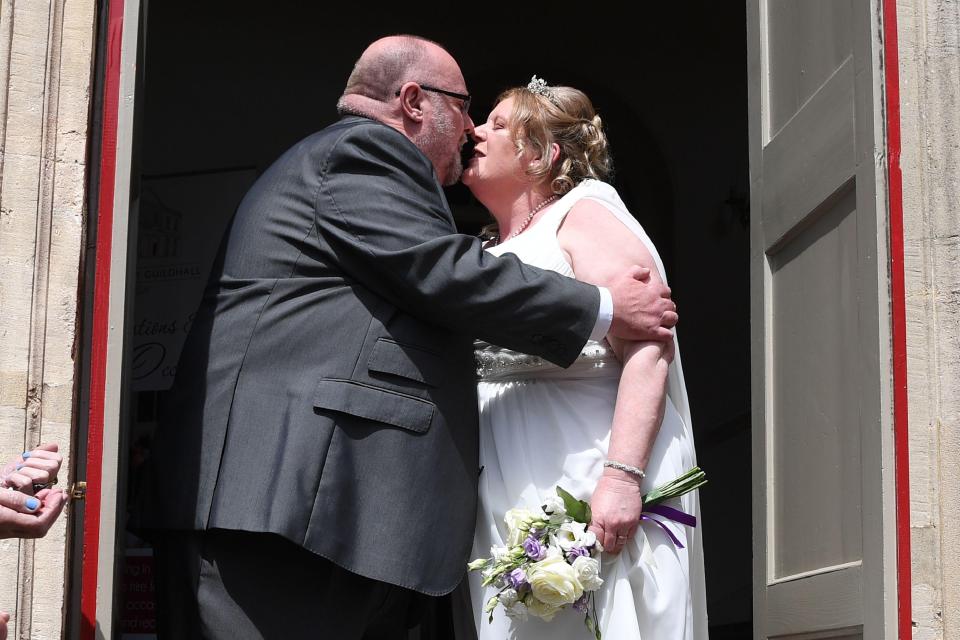 Karen Lewis and Reg Palmer kiss after getting married today