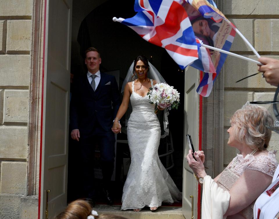 Vicky Compson and Aron Hallam outside Windsor Guildhall following their wedding, the day before Prince Harry and Meghan Markle tie the knot in the same town