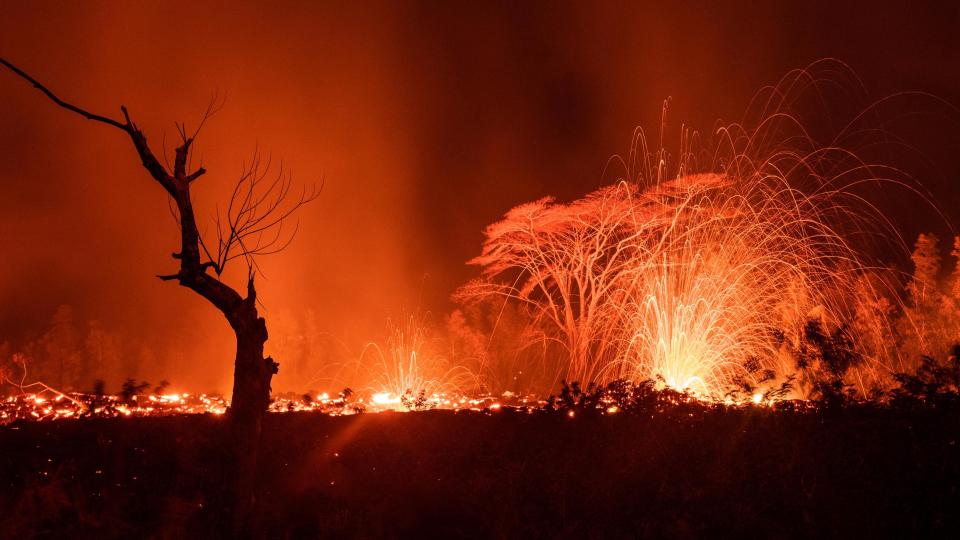  Dona Mueller, 75, from Puna , Hawaii, spotted the red lava spilling out of the volcano in front of her home