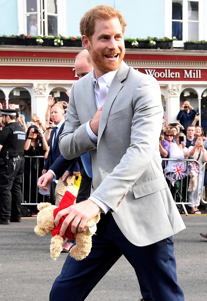  The prince clutched a teddy bear from a well-wisher outside Windsor Castle