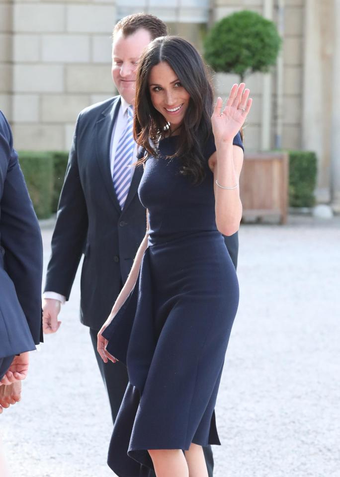  Meghan looked a picture of happiness as she waved to photographers outside Cliveden House ahead of her big day