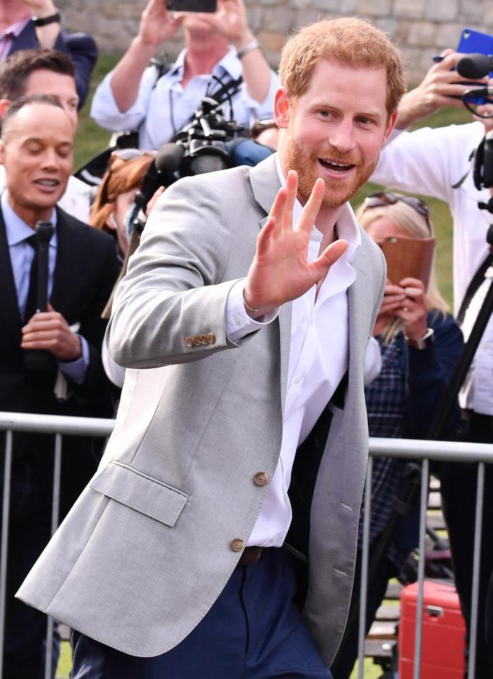  Prince Harry beams as he greets crowds in Windsor and says he 'feels great' just a day before the Royal Wedding