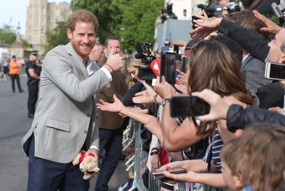  Prince Harry was in good spirits yesterday as he greeted the thousands lining the streets of Windsor ready for the big day