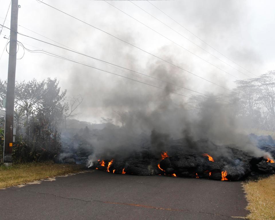  Lava blocks a road near Pahoa, Hawaii, amid fears escape routes could be cut