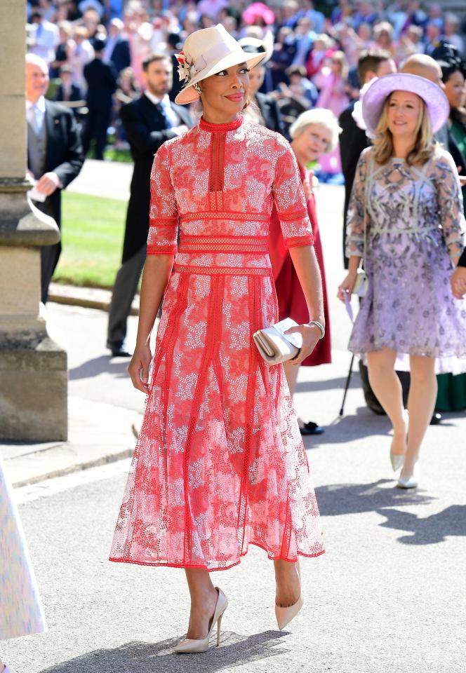  She wore nude accessories with her heels, hat and bag all gently complimenting the rouge frock