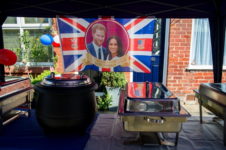 Huge pictures of Prince Harry and Meghan mark the start of the street parties