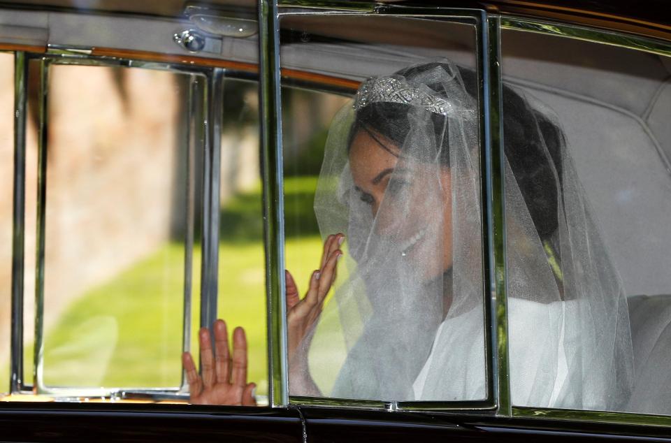  Meghan gave a nervous wave as she journeyed to St. George's chapel