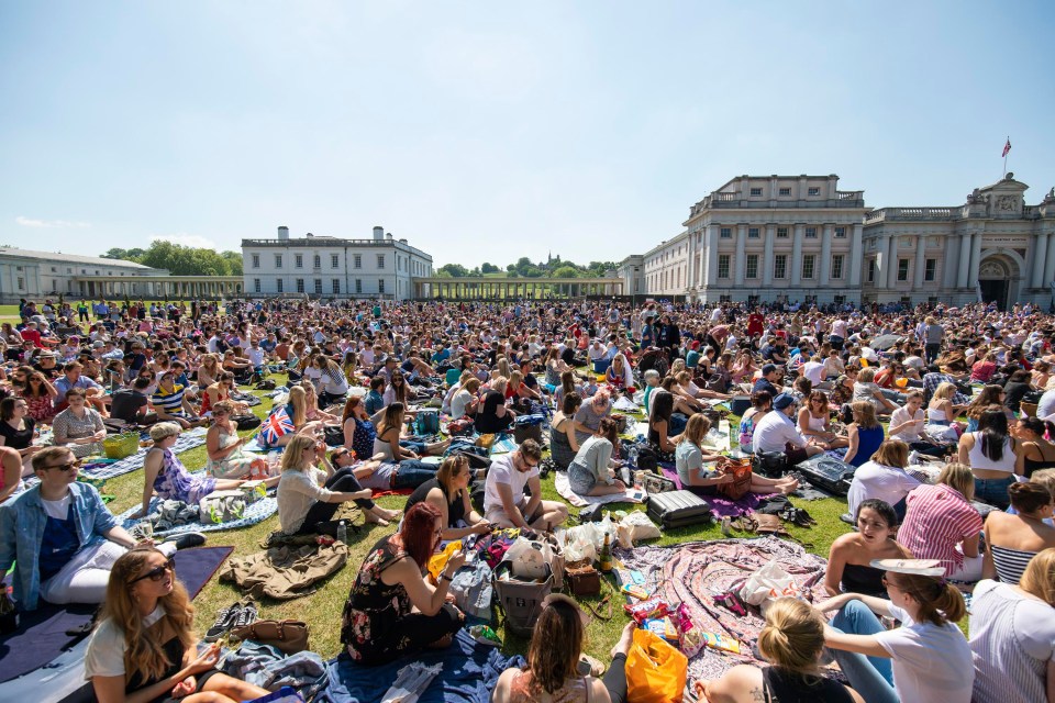 Wellwishers celebrate the Royal Wedding at an outdoor screening at the National Maritime Museum in Greenwich