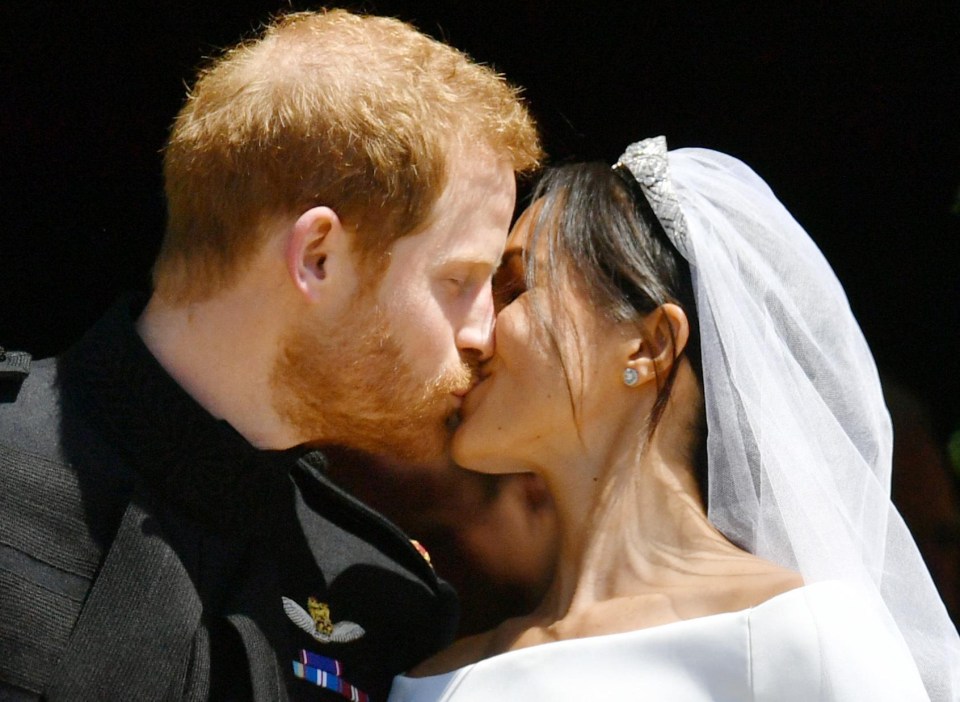 Meghan couldn't stop smiling as she kissed her prince, after a very modern ceremony that reflected their romance 