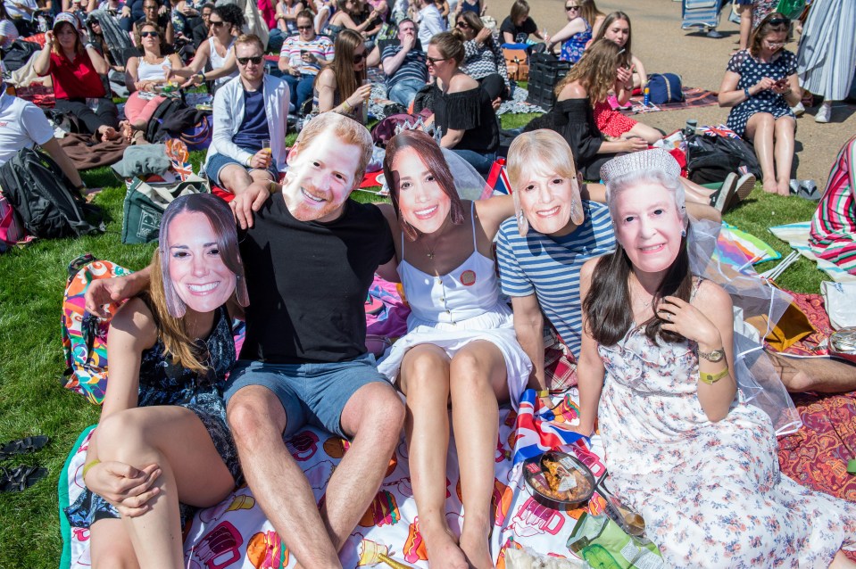 These revellers in Greenwich went all out with the royal family masks