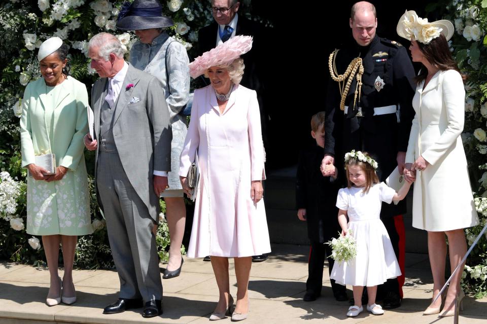  But George looked shy as he hid behind dad William's leg