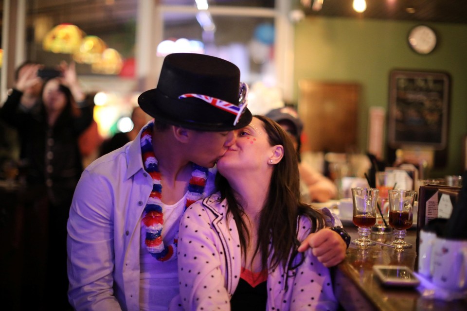 A loved up couple share a kiss at the Cat & Fiddle pub in Hollywood