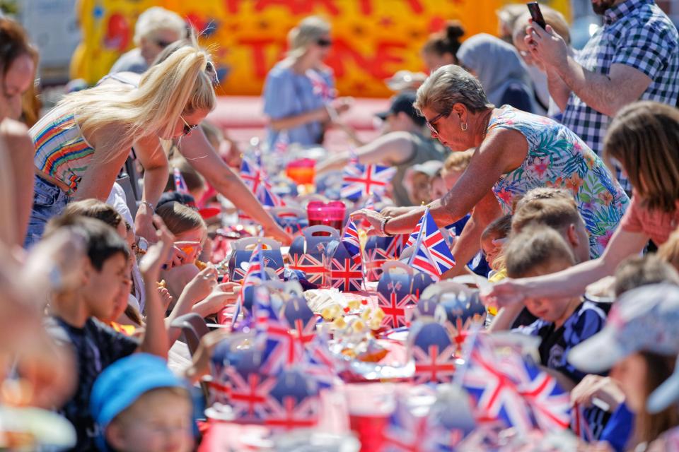  Adults and kids enjoy themselves at a street party in Cardiff