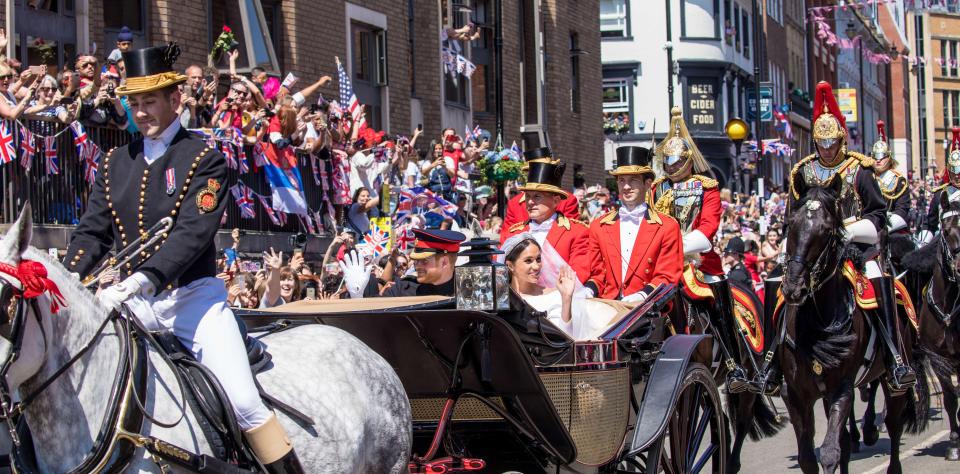  The newly-appointed Duke and Duchess of Sussex waved at crowds during a procession after their wedding