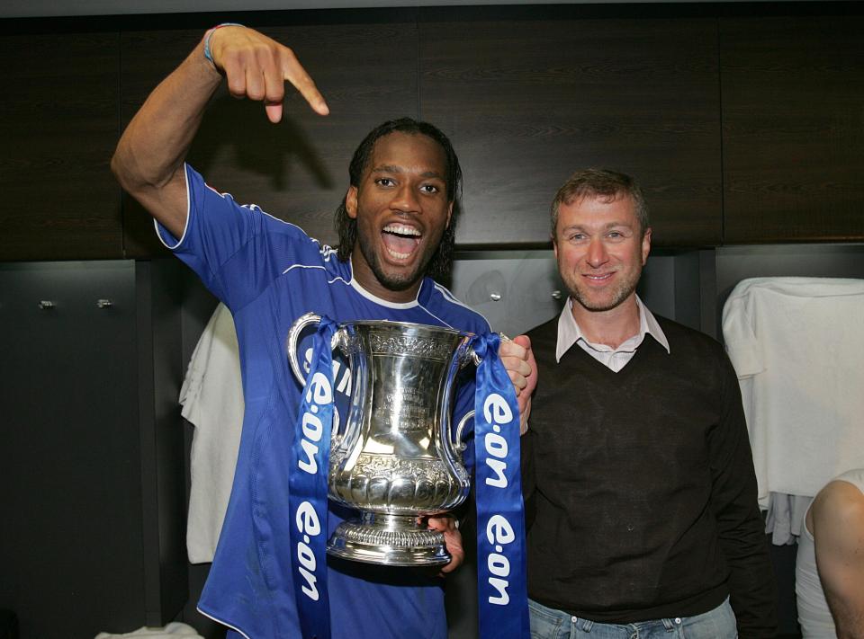  Abramovich with Didier Drogba following Chelsea's FA Cup final win in  2010