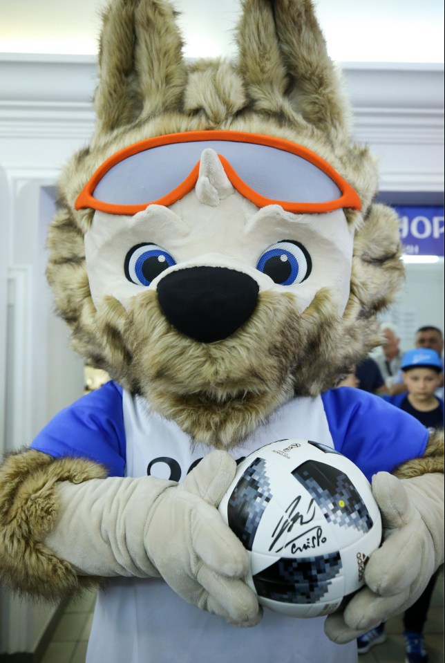 Official World Cup mascot ‘Wolf’ poses with the Telstar 18 match ball signed by retired Argentinian footballer Hernan Crespo