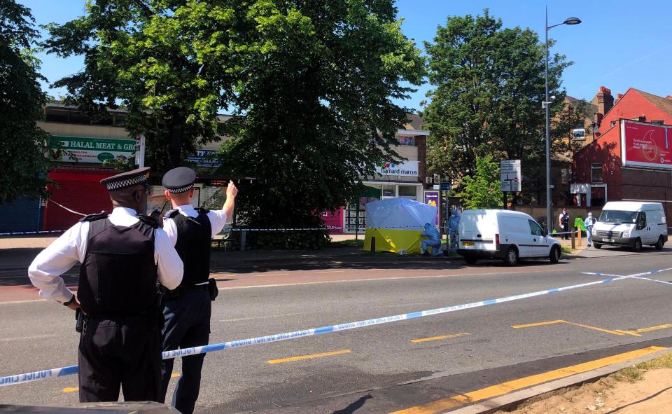  Police work at the scene where the victim died of his wounds